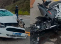 Carro branco com a frente danificada e motocicleta caída após acidente na MG-129, perto da Rampa do Voo Livre, em Itabira.